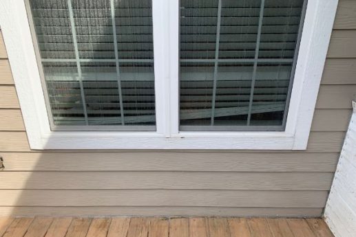 roofing contractor climbing a ladder