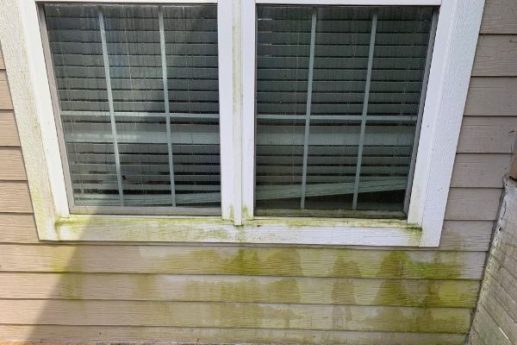 roofing contractor climbing a ladder